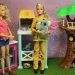 firefighter Barbie holding a koala in the animal rescue playset